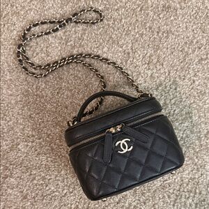CHANEL Black Quilted Mini Bag with Champagne gold Details